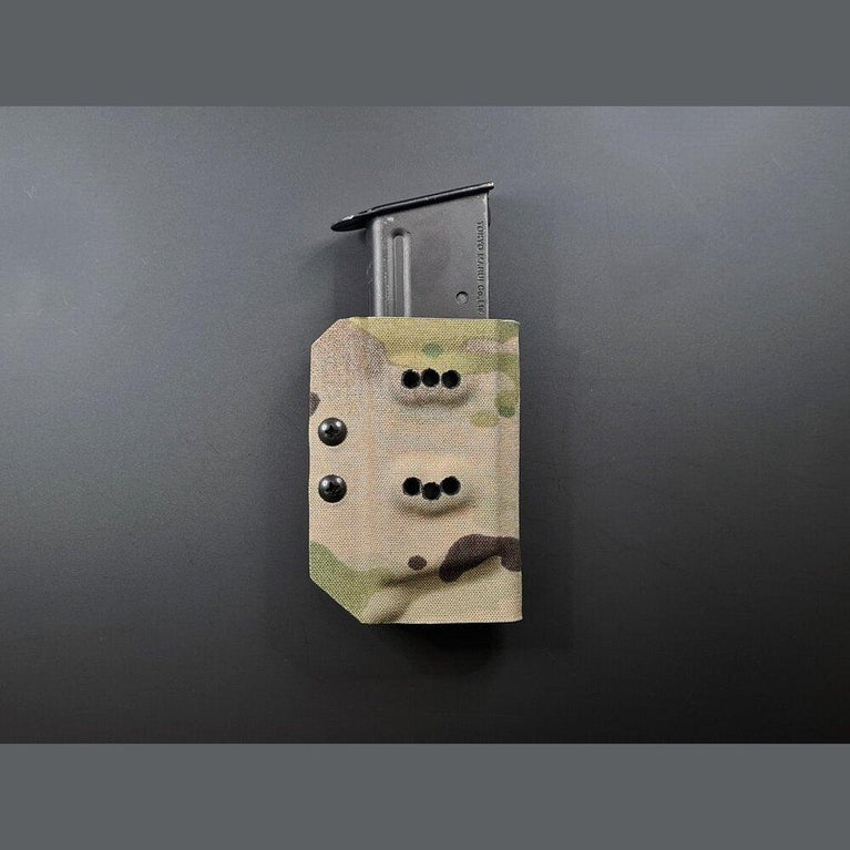 Kydex Customs Desert Eagle magazine carrier in desert tan with adjustable retention strap and belt clip attachment.