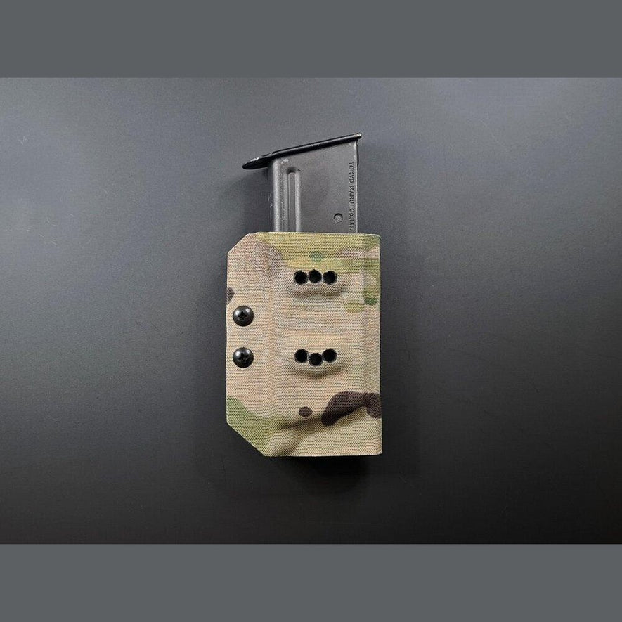 Kydex Customs Desert Eagle magazine carrier in desert tan with adjustable retention strap and belt clip attachment.